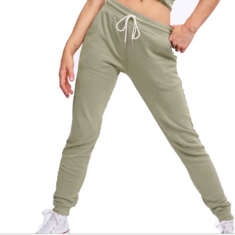 MATE light green tapered joggers with a drawstring waist and cuffed ankles